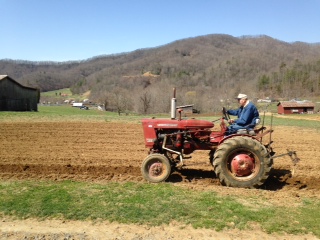 tractor plowing a field