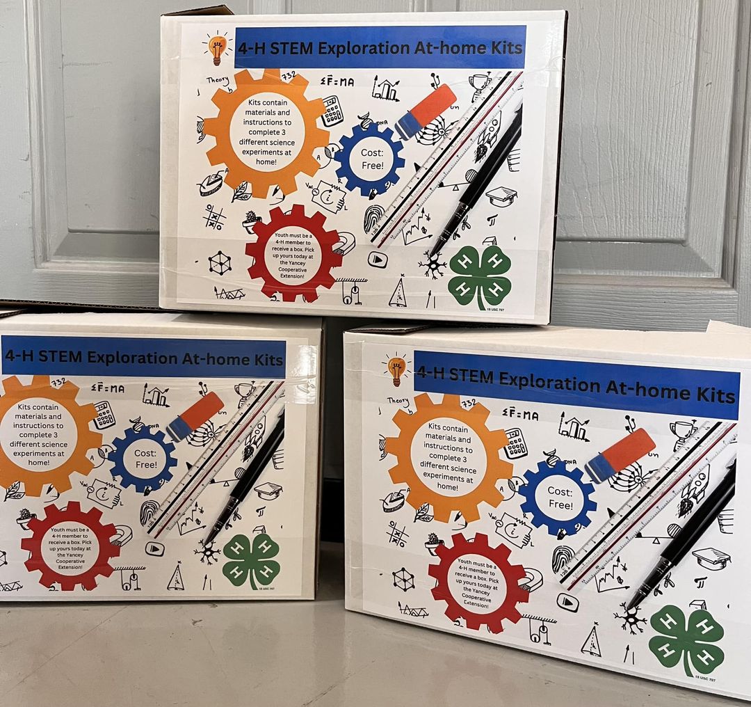 Boxes labeled 4-H Stem Exploration At-home kits. 